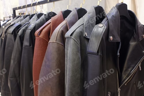 Preview: different leather motorcycle jackets on hangers on clothing rail