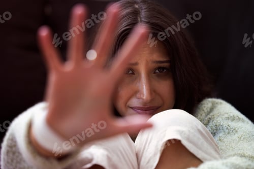 Preview: Shot of a young woman looking distressed and reading out her hand