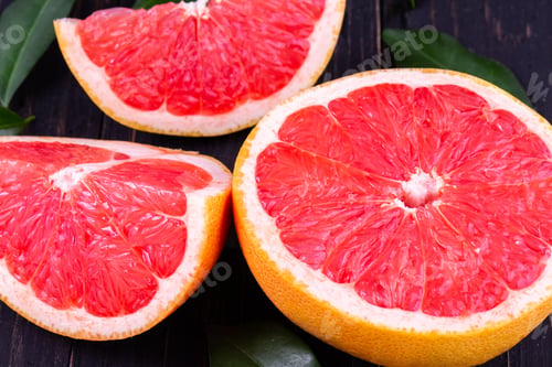 Preview: orange and grapefruit juice On a wooden black background