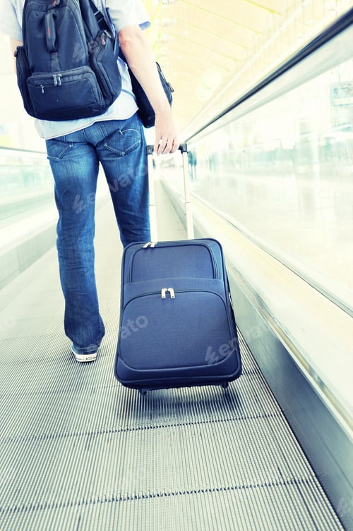 Preview: Traveler With A Suitcase On The Speedwalk