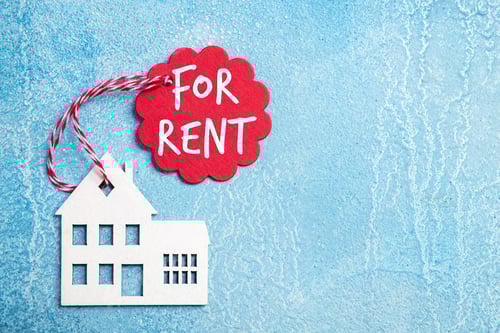 Preview: House for rent label on christmas holidays. Wooden house symbol with rent tag on blue
