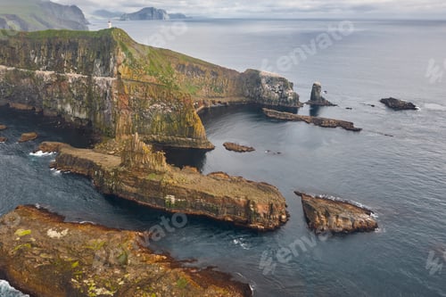 Preview: Faroe islands dramatic coastline viewed from helicopter. Mykines island
