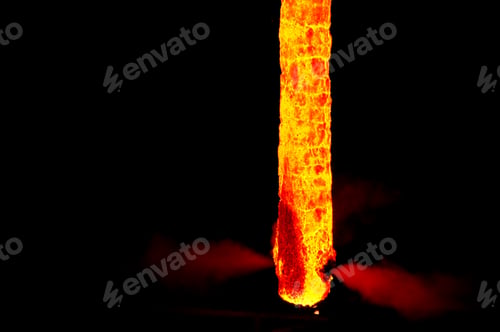Preview: Closeup shot of forging metal on a dark background
