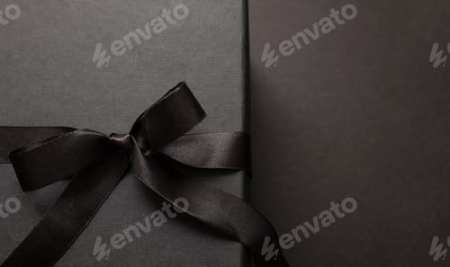 Preview: Black Friday sale concept, Gift box with ribbon bow detail on black background