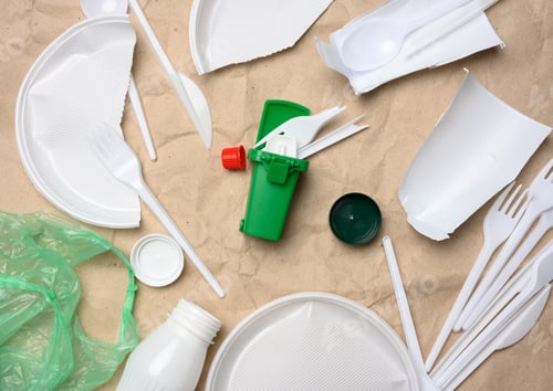 Preview: Plastic waste from life on the background of brown kraft paper, environmental pollution