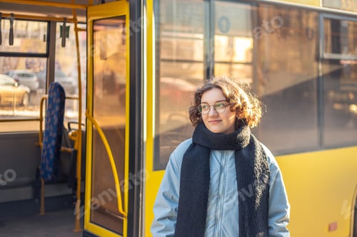 Preview: Public transport. Waiting for the bus. Student girl waiting for transport.