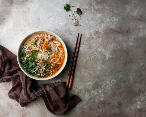 Preview: Bowl of Asian Soup with Noodles and Greens