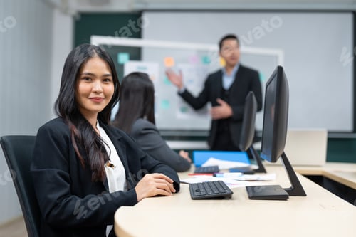 Preview: Asian businesswoman meeting with team of colleagues discuss planning strategy in office.