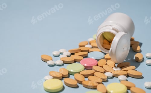 Preview: A variety of tablets and nutritional supplements of different colors are dynamically poured out