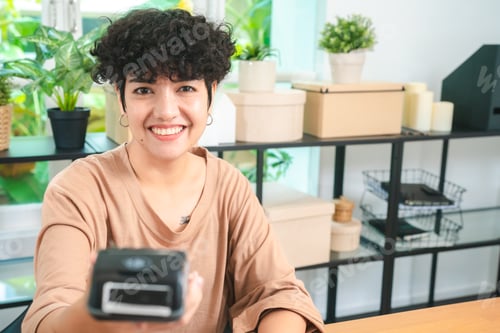 Preview: Asian Woman Thrives in Online Business: Entrepreneurship from Home, Shipping Products