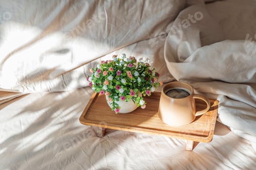 Preview: Coffee and Flower Arrangement on Wooden Tray in Cozy Sunlit Interior