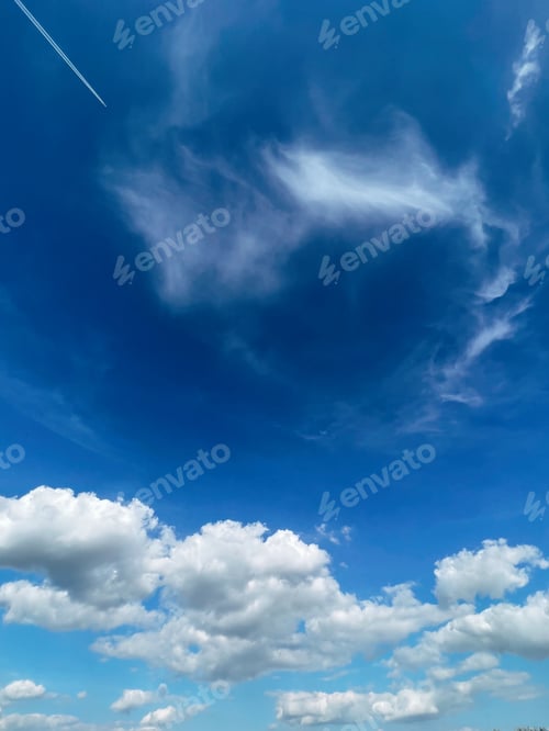 Preview: Blue sky with fluffy white clouds
