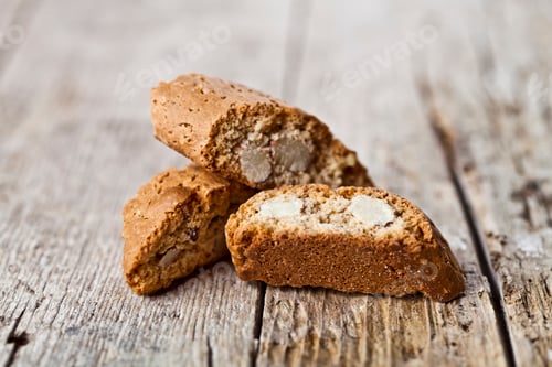 Preview: Homemade Italian cookies cantuccini heap with almond seeds on ructic wooden table