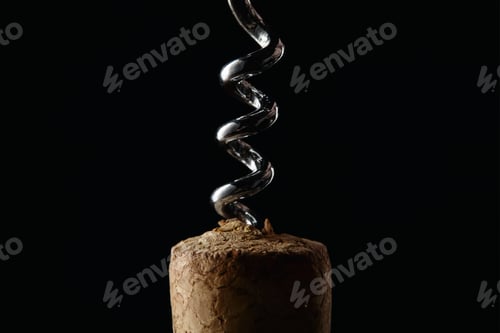 Preview: Close up view of wooden cork and steel corkscrew isolated on black