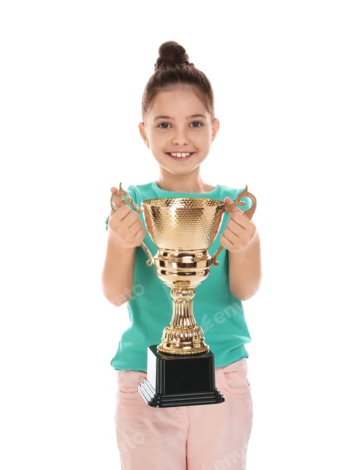 Preview: Happy girl with golden winning cup isolated on white