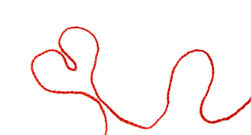 Preview: Red thread isolate on white background. Selective focus.