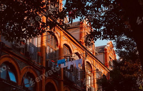 Preview: Exterior of a beautiful old building with laundry hanging from the wires