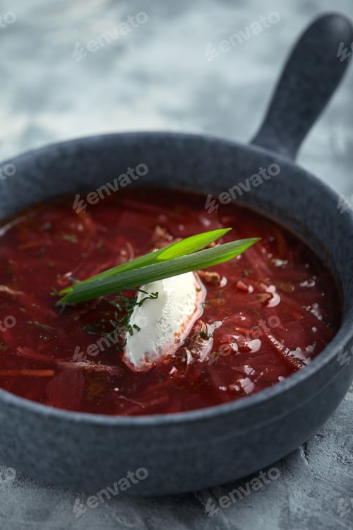Preview: Traditional Ukrainian Russian borsch with sour cream on a bowl. A plate of red beetroot soup borsch