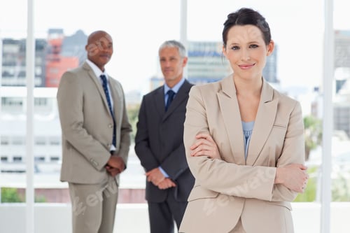 Preview: Young Smiling Secretary Crossing Her Arms In Front Of Two Executives
