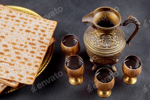 Preview: A Jewish Matzah bread with four glasses wine. Passover holiday concept