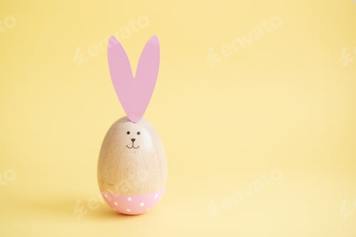 Preview: Colorful easter eggs yellow background. Easter holiday concept