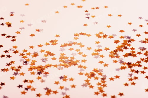 Preview: Beautiful golden sprinkled stars on the light background.