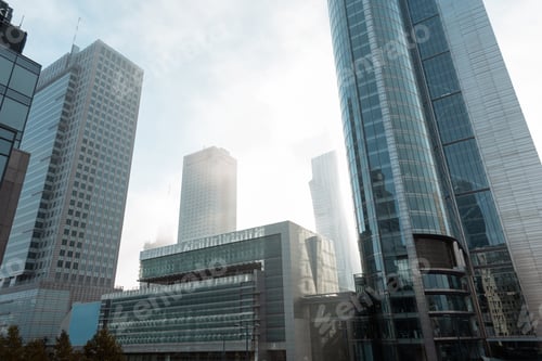 Preview: Beautiful modern metropolis in the fog with business and office buildings