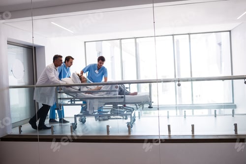 Preview: Team of doctors taking pregnant woman to operation theatre