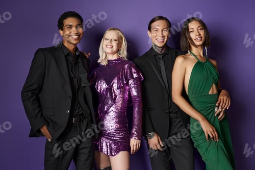 Preview: Christmas party, happy multiethnic male and female friends in festive attire hugging on purple