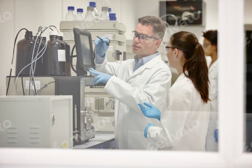 Preview: Scientists working in laboratory