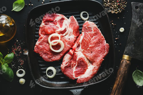Preview: Raw meat on pan on dark