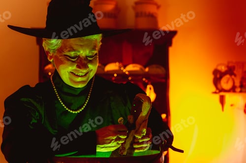 Preview: old witch smiles while voodoo