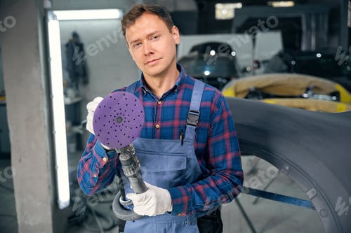 Preview: Male working with instrument for polish surface