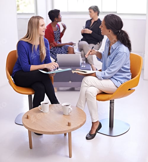 Preview: Teamwork is the key. Shot of a group of female designers sitting in a creative meeting.