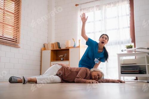 Preview: senior patient falling on the ground floor at home, Asian caregiver helping elderly older female