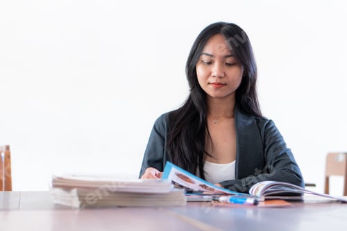 Preview: Young female student study in the school library. white background