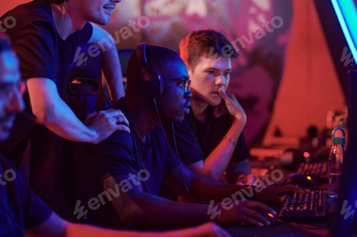 Preview: Gamers of esports team analyzing tactic of game