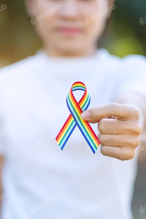 Preview: hand showing LGBTQ Rainbow ribbon