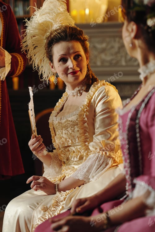 Preview: Portrait of Caucasian Young Adult Woman Wearing Baroque Costume Smiling Indoors