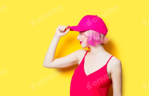 Preview: smiling young woman in cap