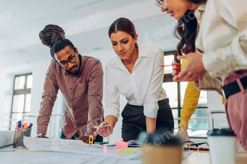Preview: Diverse group of engineers or architects having a meeting in an office