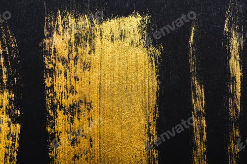 Preview: top view of yellow watercolor brushstrokes on black paper