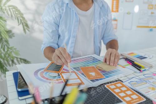 Preview: A focused designer is working on UX/UI design ideas