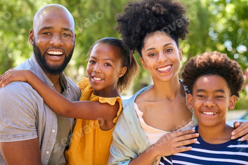 Preview: Portrait Of Smiling Family Standing In Summer Garden Or Countryside Smiling At Camera