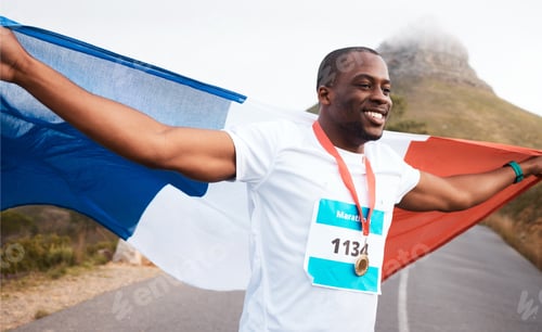 Preview: Winner celebration, flag and happy black man, runner and marathon victory of challenge, sports comp
