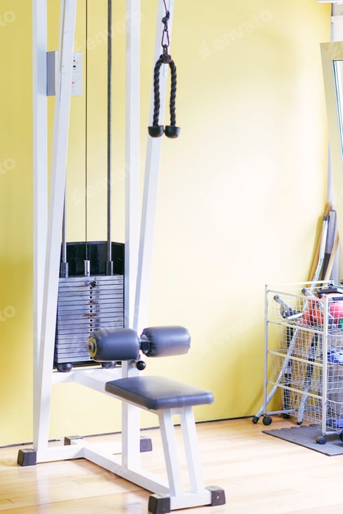 Preview: Close up view of a handle of a hand pull machine in a modern fitness center. Gym equipment