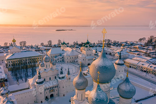 Preview: Church domes with golden crosses during sunset in Rostov Kremlin next to the Nero lake, Russia