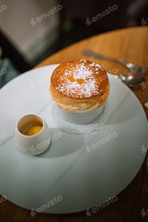 Preview: Gourmet Souffle Dessert with Custard and Powdered Sugar