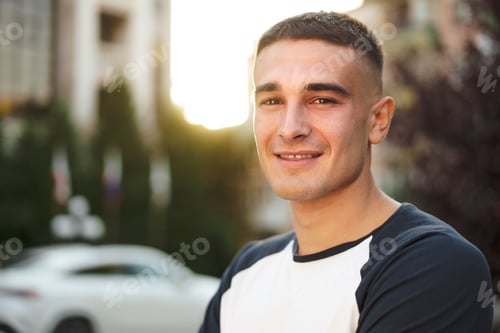 Preview: Portrait of handsome young casual man walking on the street