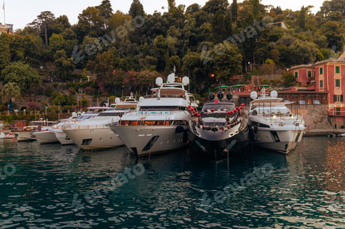 Preview: Liguria, Italy, Europe. Luxury yachts and boats in The beautiful Portofino with colorful houses and